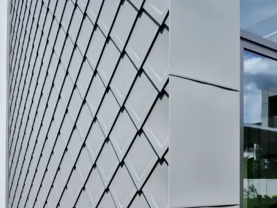 Point de détail des losanges de toiture 29x29 posé dans la teinte P.10 gris souris.
