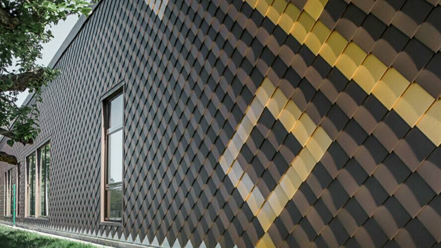 Façade avec losanges PREFA 20×20 couleur brun. Des losanges couleur or créent un motif sur la façade.