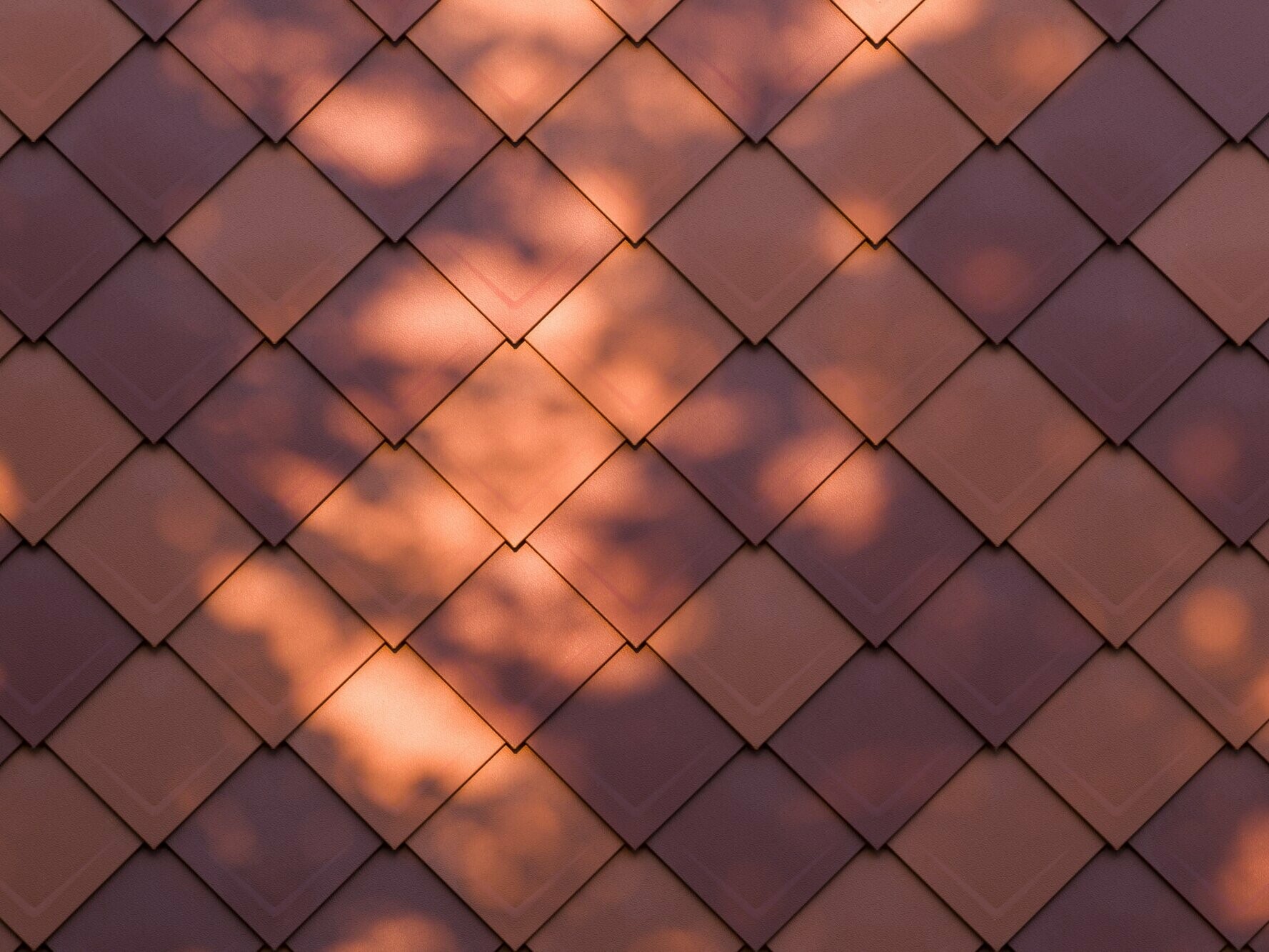 Zoom sur le jeu d'ombre et de lumière sur les losanges en aluminium PREFA