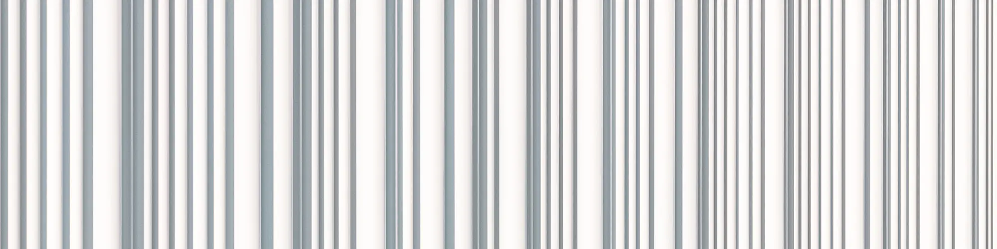 Un gros plan sur la façade PREFA blanc pur, profilée, avec son caractère ondulé irrégulier.