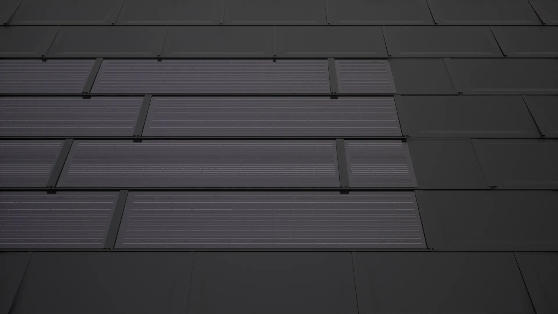 Tuiles solaires PREFA noires avec tuiles de raccord. Ceux-ci permettent d'obtenir une surface modulaire rectangulaire et contribuent à l'harmonie de l'ensemble de la toiture solaire.