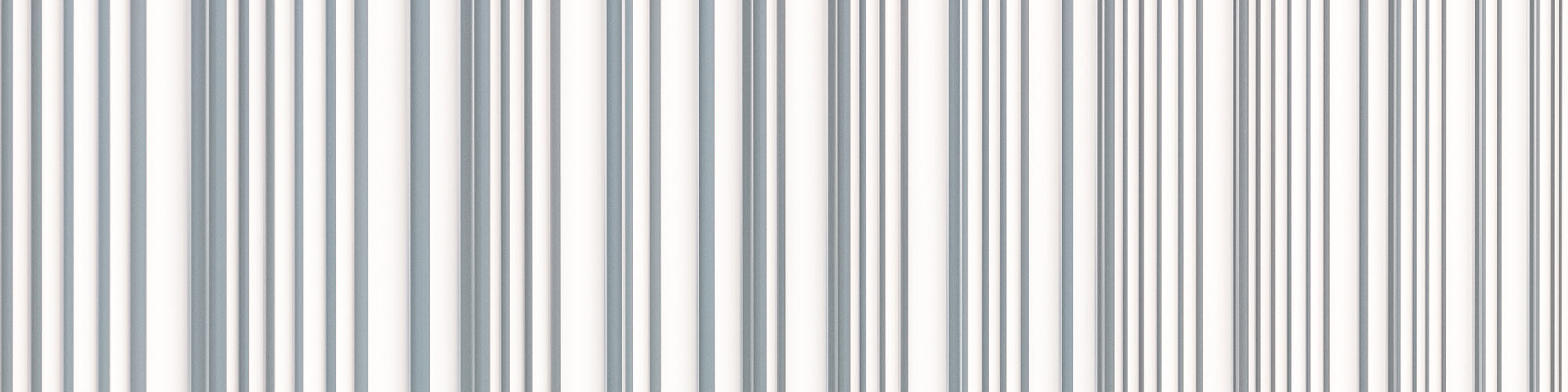 Un gros plan sur la façade PREFA blanc pur, profilée, avec son caractère ondulé irrégulier.